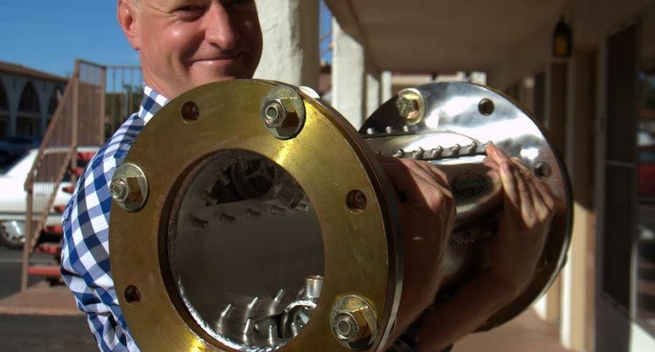 Jody Spencer holding the $800 from Rainmaker H2O.